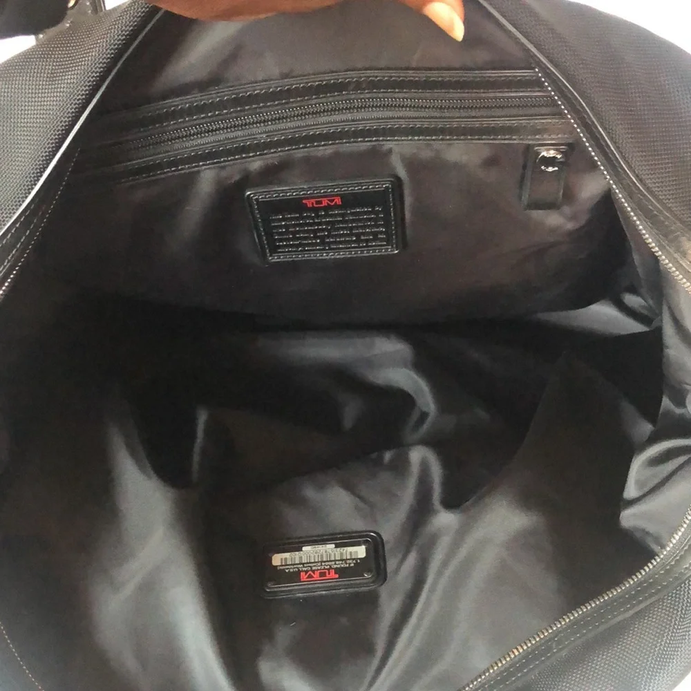 TUMI black Boston 2 way leather and canvas and mini lock. Detachable straps.